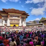 A large crowd in the courtyard of Gangtey Goenpa for the Black-Necked Crane Festival