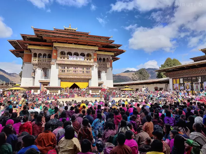 A large crowd in the courtyard of Gangtey Goenpa for the Black-Necked Crane Festival
