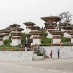 The 108 chortens on the Dochu La pass, with cloud in the trees behind