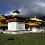 Jambay Lhakhang in Bumthang, the temple where the Drup is held, under dark cloud
