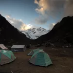 Tents at the Jangothang camp at dusk, with Mount Jomolhari at the head of the valley