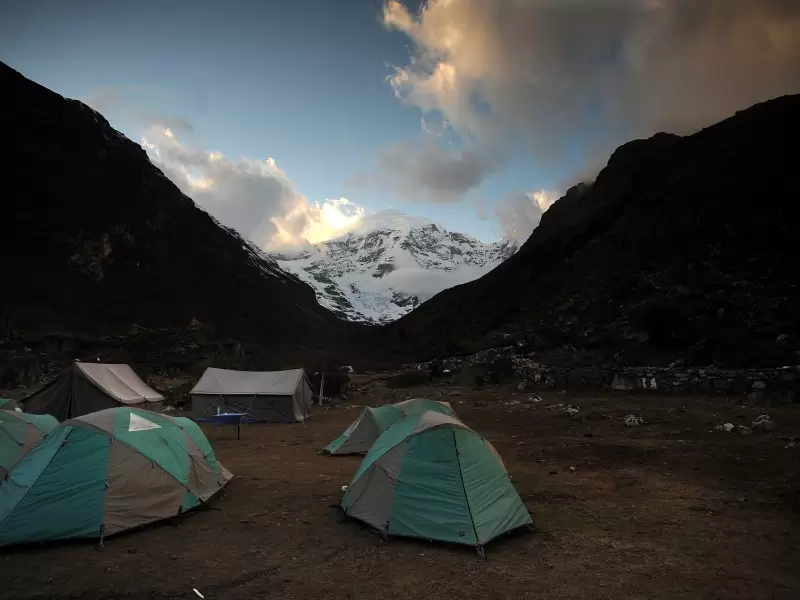 Tents at the Jangothang camp at dusk, with Mount Jomolhari at the head of the valley