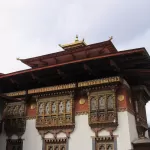 The central tower of Punakha Dzong rising above its courtyard