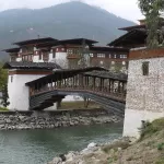 The covered wooden bridge across the Mo Chhu to Punakha Dzong