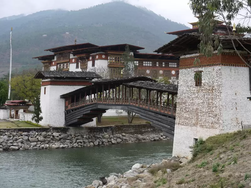 The covered wooden bridge across the Mo Chhu to Punakha Dzong